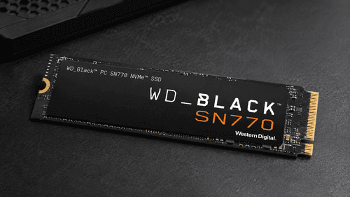 Amazon Renewed WD_BLACK SN770 2TB NVMe SSD installed on gaming PC motherboard with heatsink visible